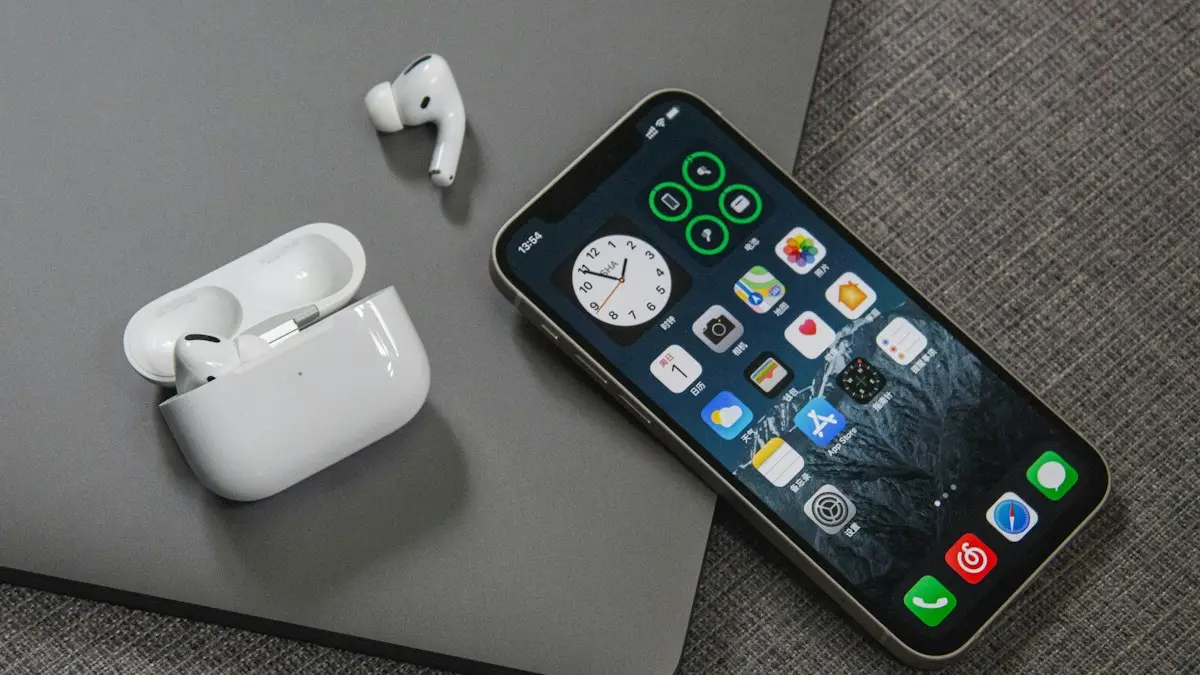 Space gray iphone 6 beside apple earpods
