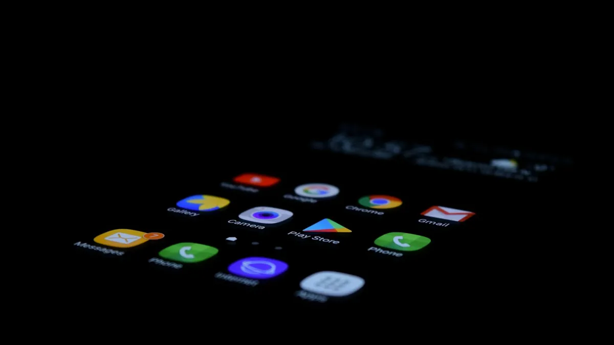 Android app icons glowing on a dark phone screen