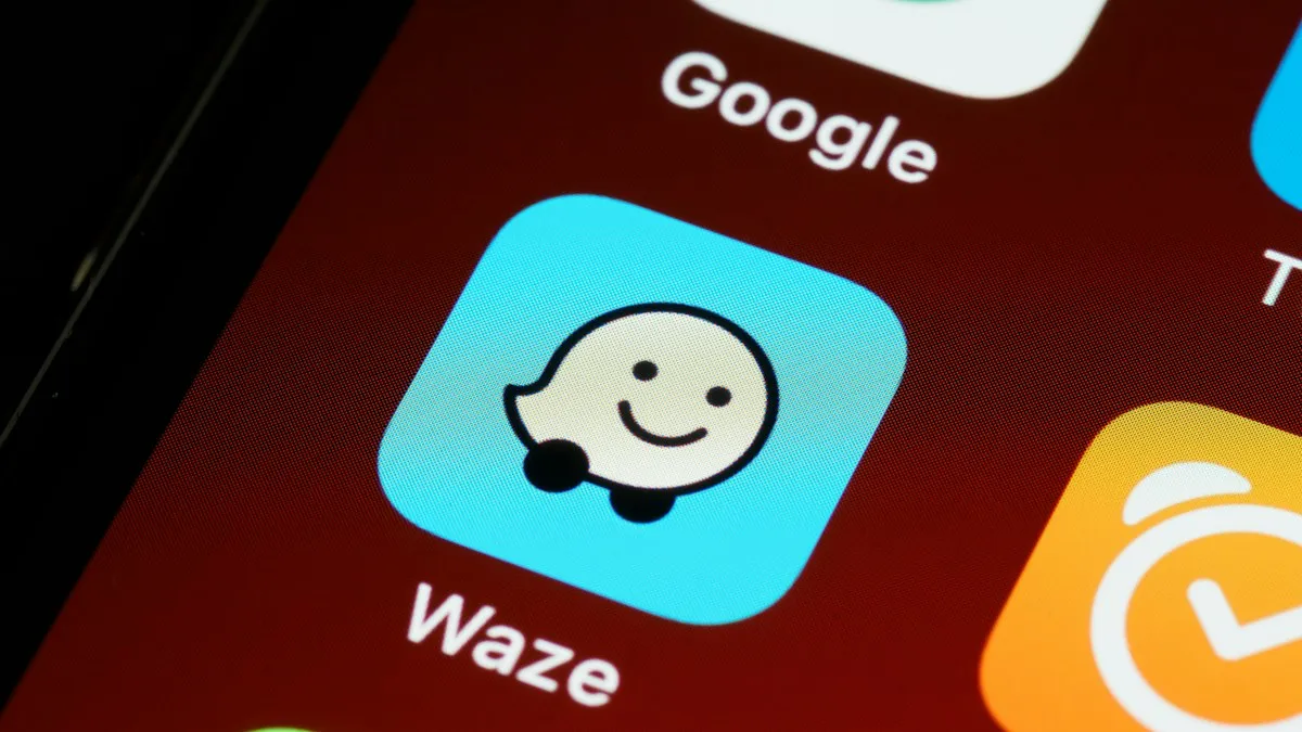 A black smartphone showing app icons