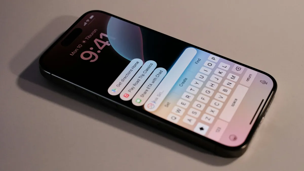 A close up of an iPhone showing the on-screen keyboard and lock screen