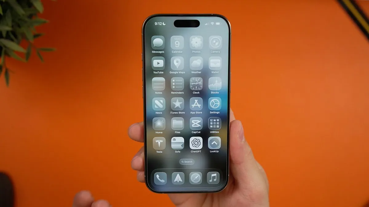 A person holding an iPhone that shows apps