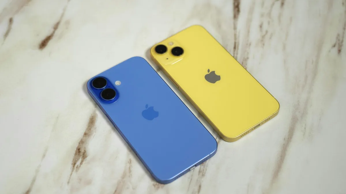 Two iPhones sitting next to each other on a table
