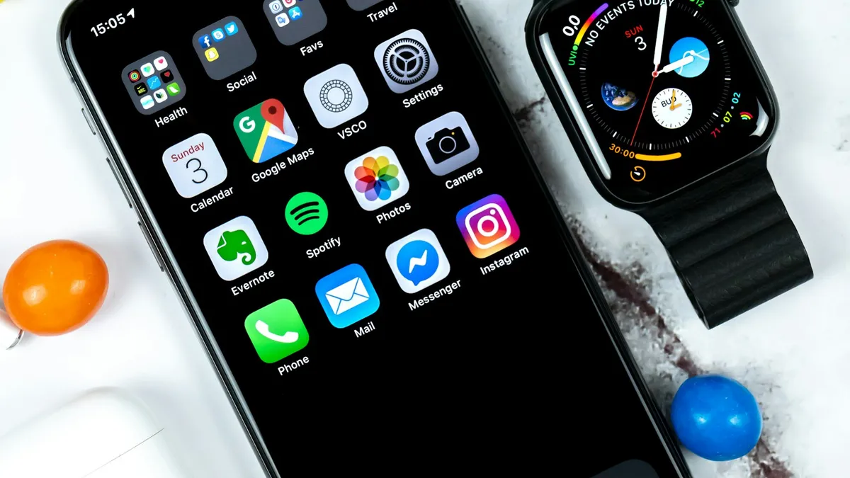 An Apple Watch beside an iPhone