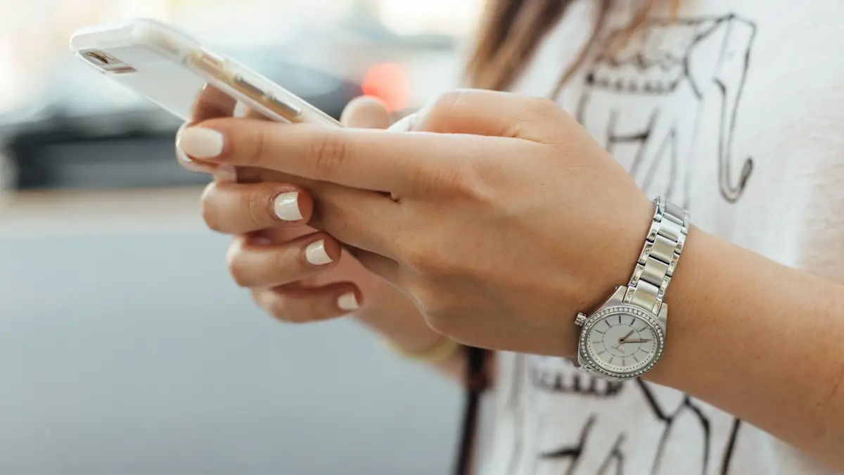 Woman holding iPhone during daytime